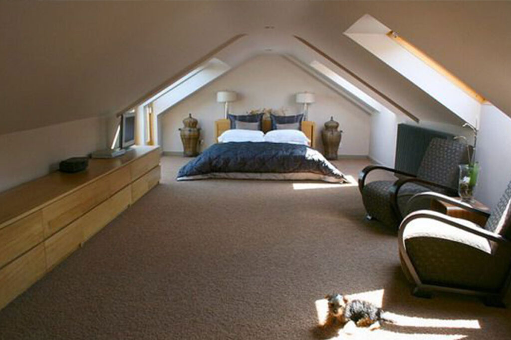 Beautiful bedroom and living area to show attic spaces created by timber frame manufacturer Merronbrook Ltd