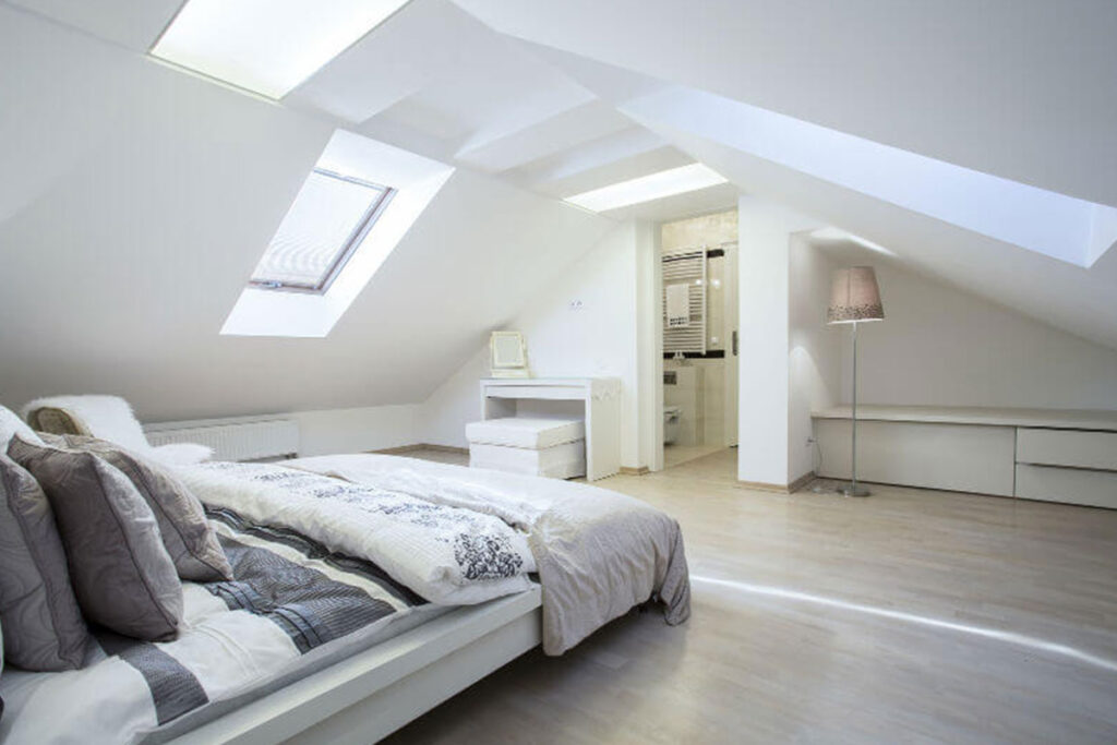 Beautiful sunny bedroom created in an attic to show construction as carried out by roof joists experts Merronbrook Ltd